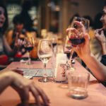 people enjoying drinking wine